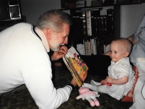 My daughter enjoying a book with her uncle